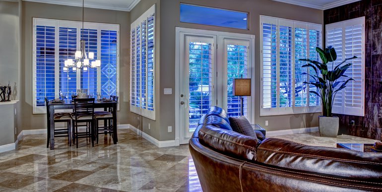 Washington DC great room with classic shutters and tile floor.